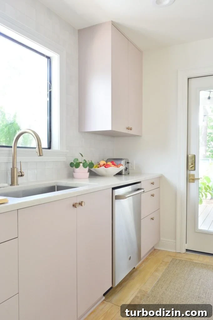 Small Ikea Kitchen Organization Ideas for Tight Spaces 10 Angled View Of Painted Mauve Pink Kitchen Cabinets With Gray Backsplash