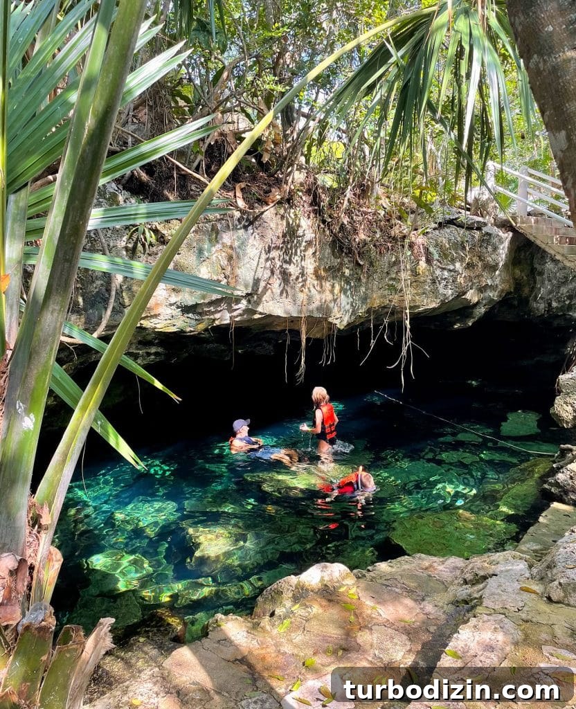 Traveling to Mexico with Kids and a Dog: Family Guide 14 Family Swimming Under Cave At Cenote Cristalino in Akumal Mexico