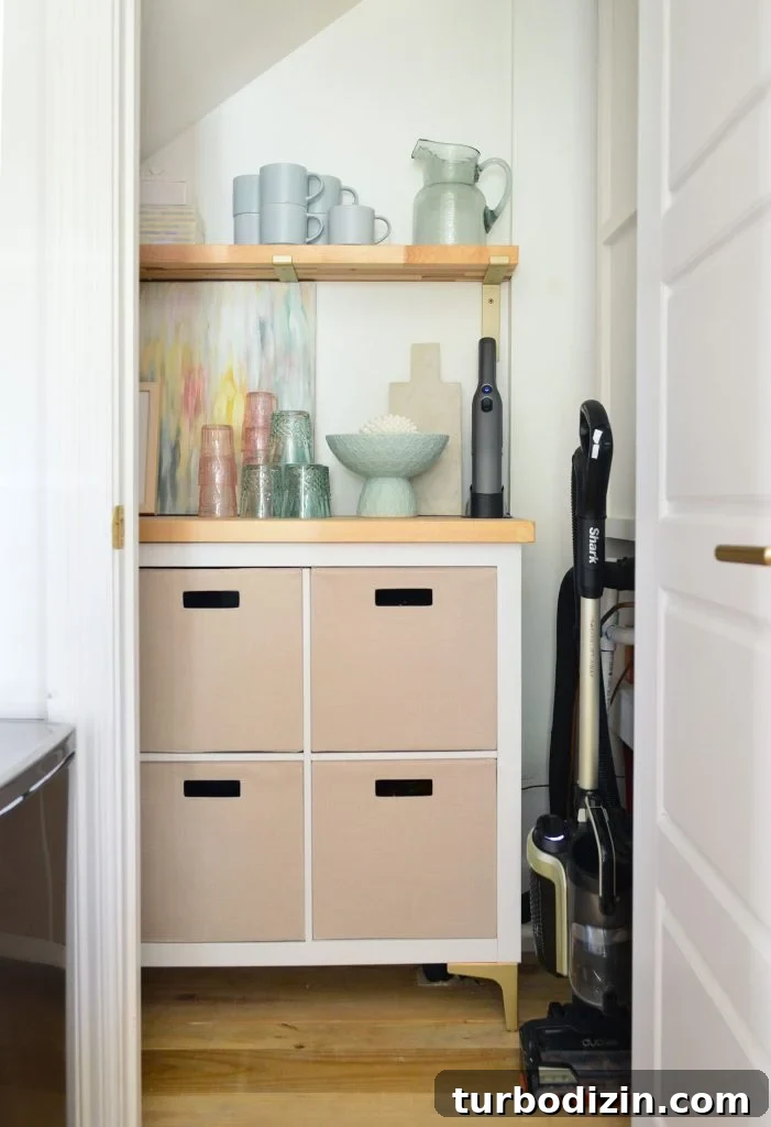 After Photo Of Utility Closet With Pretty Cubby Storage And Butcher Counter