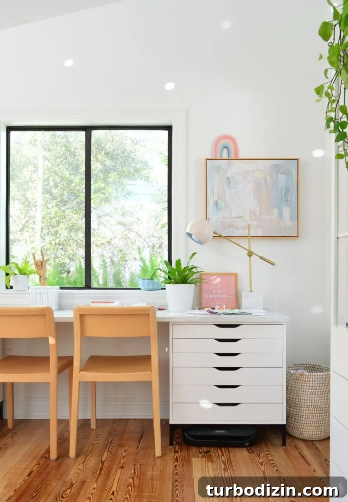 Kids art desk made from Ikea dressers and laminate marble countertop with wood chairs