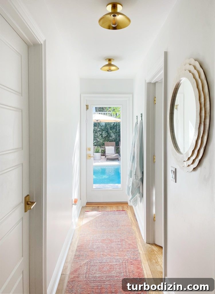 Rooms You Don't Miss After Downsizing: What to Leave Behind 5 Hallway With Traditional Rug Leading To Pool