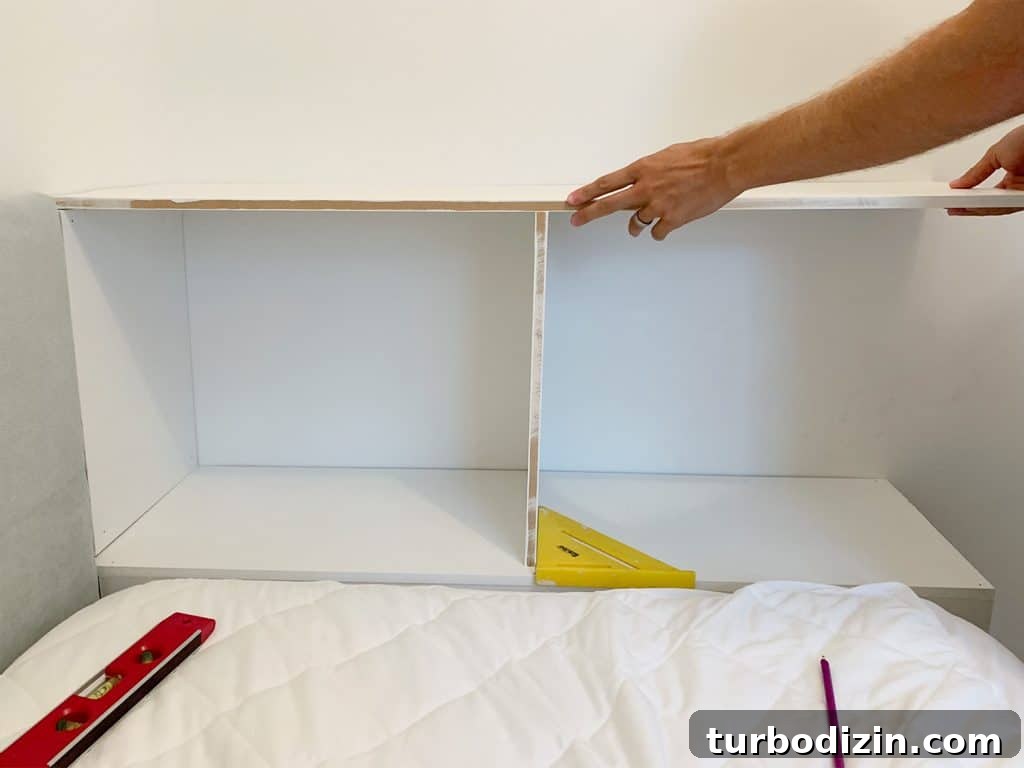 Build a Sturdy Bookshelf: Step-by-Step DIY Guide for Any Room 7 Fitting top shelf of built-in bookcase at the foot of boys bed
