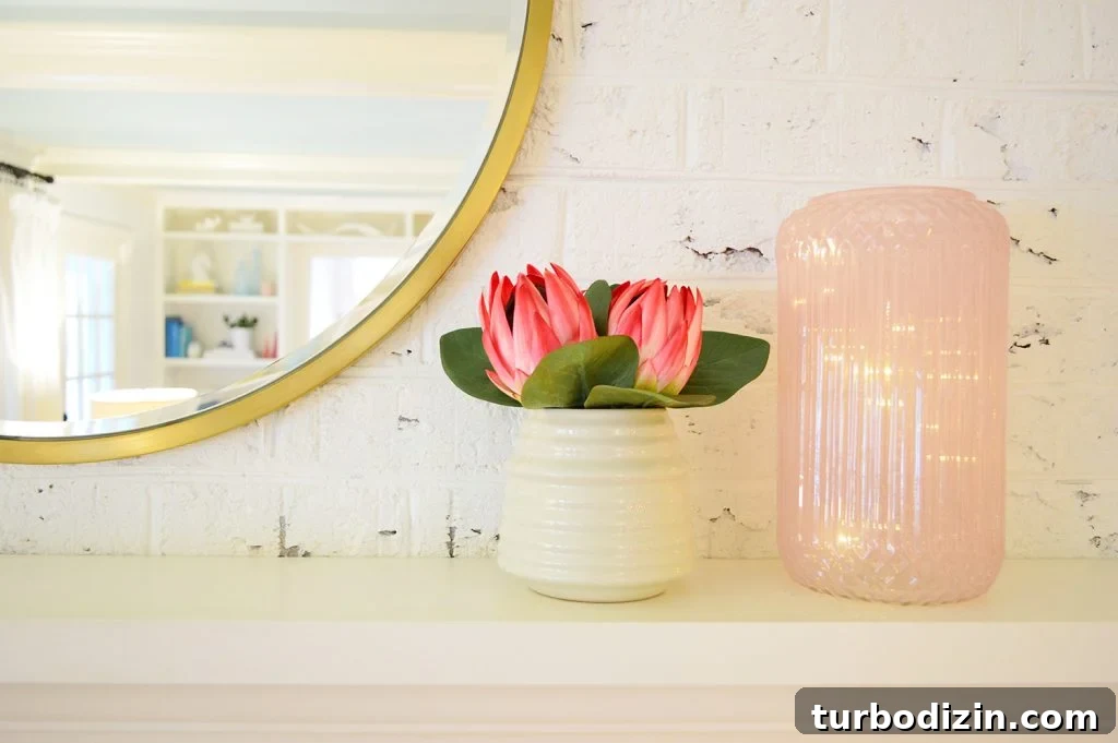 Pink Vase On Christmas Mantle With Fairy Lights Inside