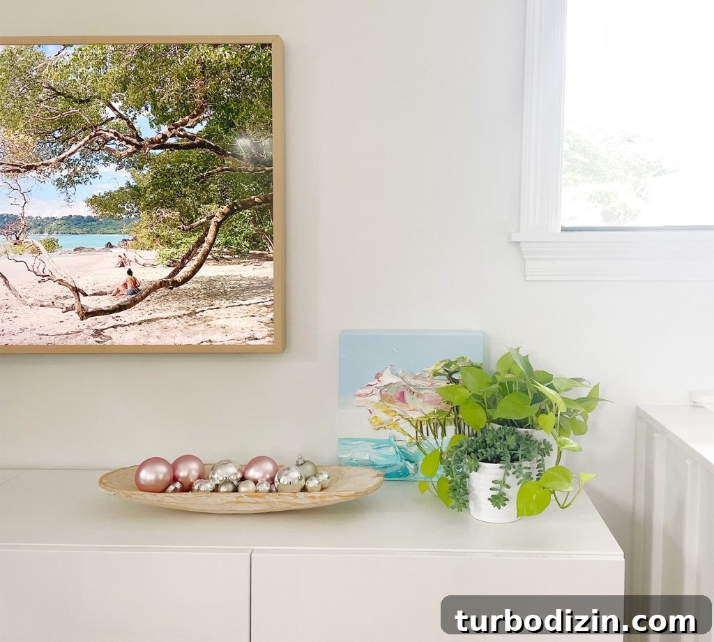 Dough Bowl With Christmas Ornaments On Media Console Under TV