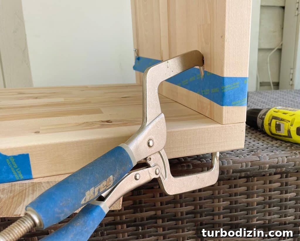 Build Stylish Modern Nightstands: DIY Step-by-Step Guide 9 Kreg Pocket Hole Clamp Holding Butcher Block Nightstands Together During Construction