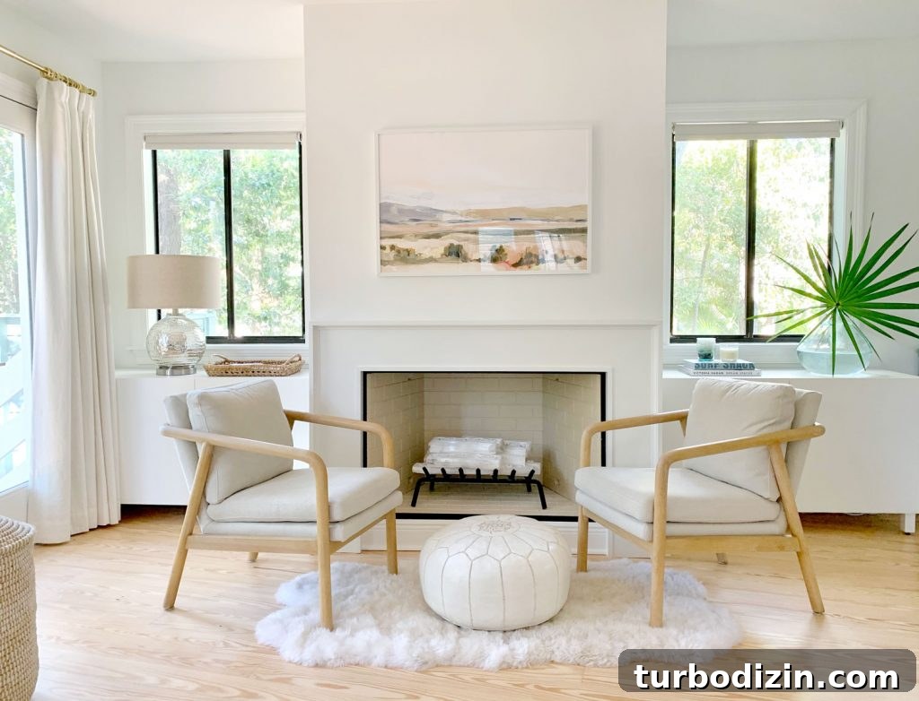 Transform IKEA Besta into Seamless Built-In Storage 4 Bedroom fireplace view with two chairs and Ikea Besta cabinets sitting on either side of fireplace