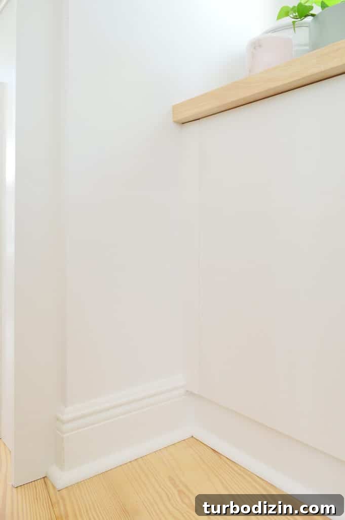 Transform IKEA Besta into Seamless Built-In Storage 8 Close up detail of trim added to side of Ikea Besta cabinets to look flush with doors