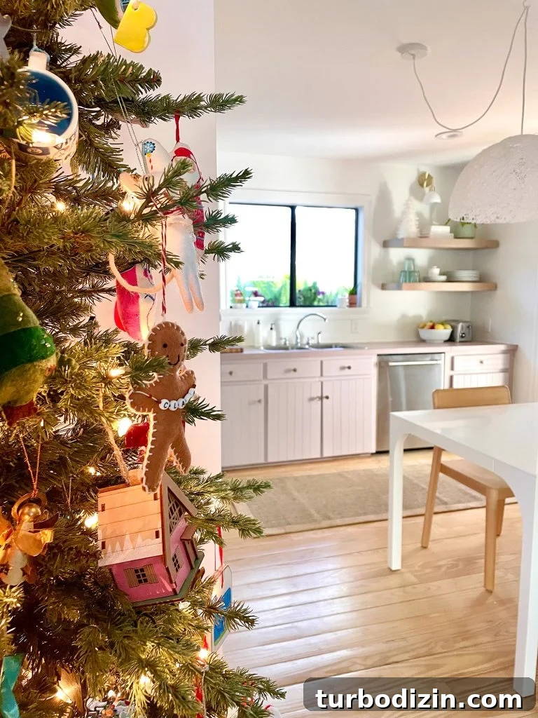 Side of Christmas tree near pantry in kitchen