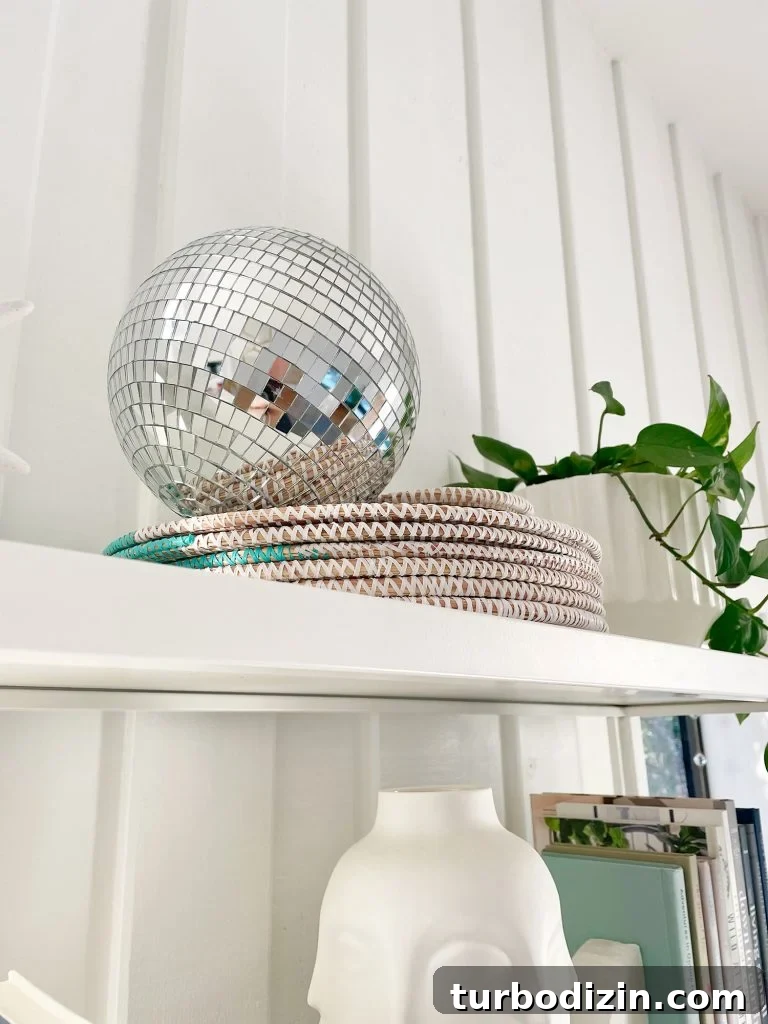 Decorative disco ball on top of shelves in office