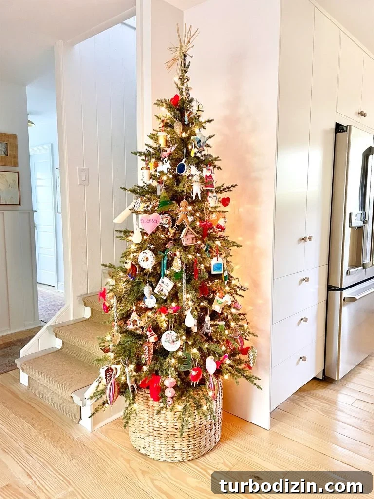 Narrow Christmas Tree in corner of kitchen next to pantry and stairs