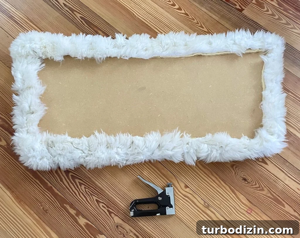 DIY Faux Sheepskin Seat Cushion: Step-by-Step Sewing Guide 6 Backside of loveseat seat upholstered with sheepskin rug