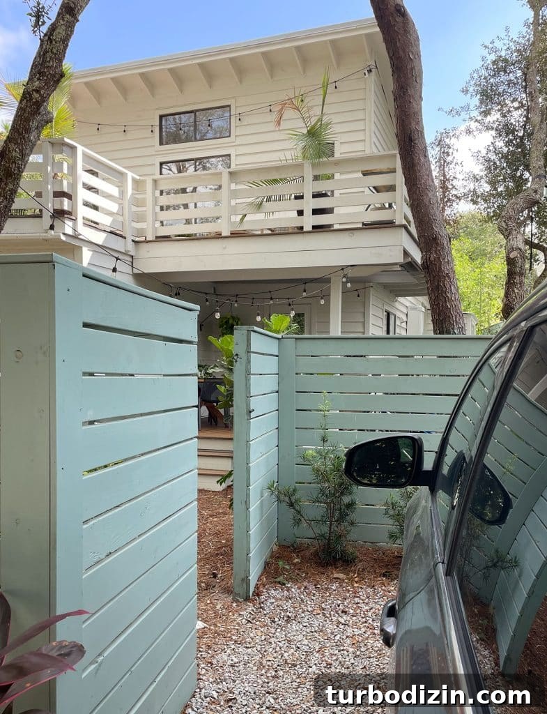 Open Fence Gate Showing Car Parking Access To Kitchen Porch