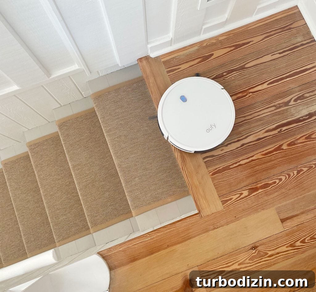 Are Robot Vacuums Worth the Investment? 11 Eufy RoboVac 11S Vacuuming At The Stop Of Stairs Without Falling