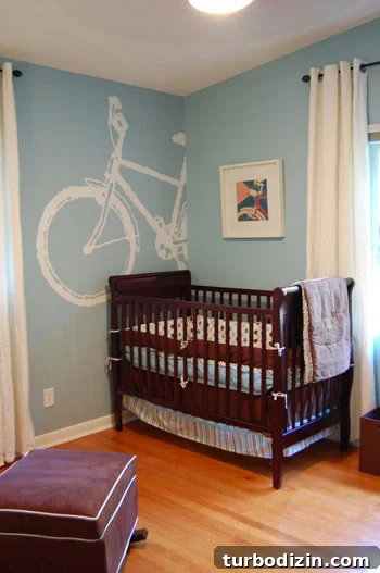 Blue Nursery Design Featuring a Charming Bike Mural 3 nursery-after