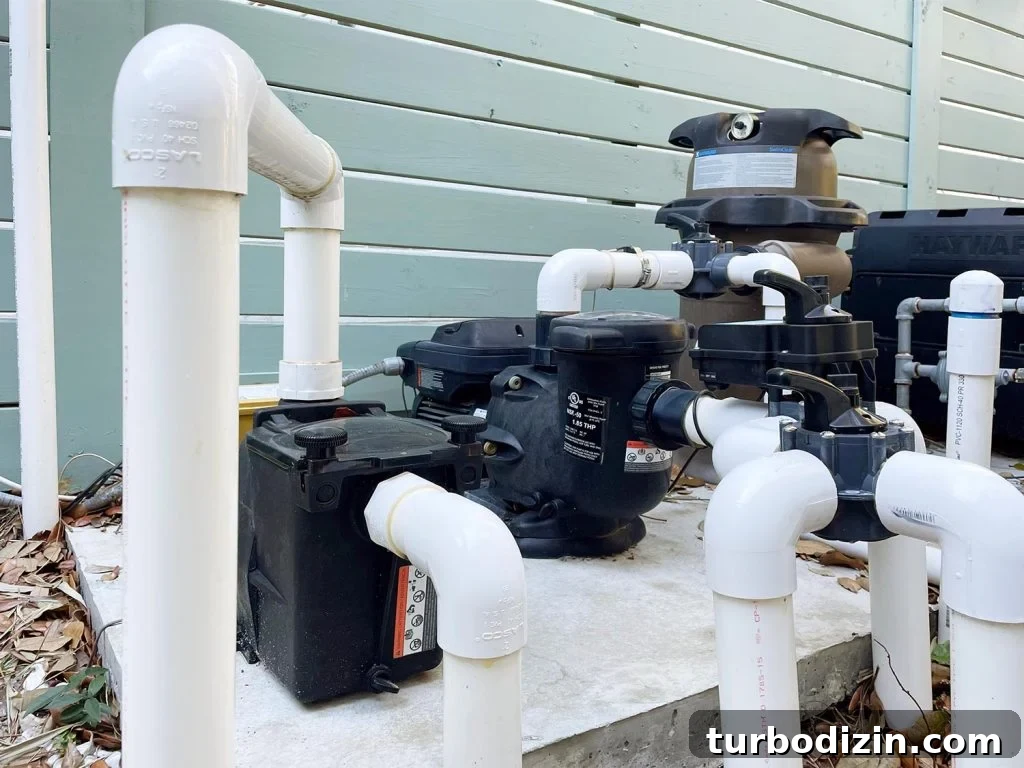 5 Smart Ways to Prevent Pipes from Freezing This Winter 8 Pool equipment with exposed white PVC pipes