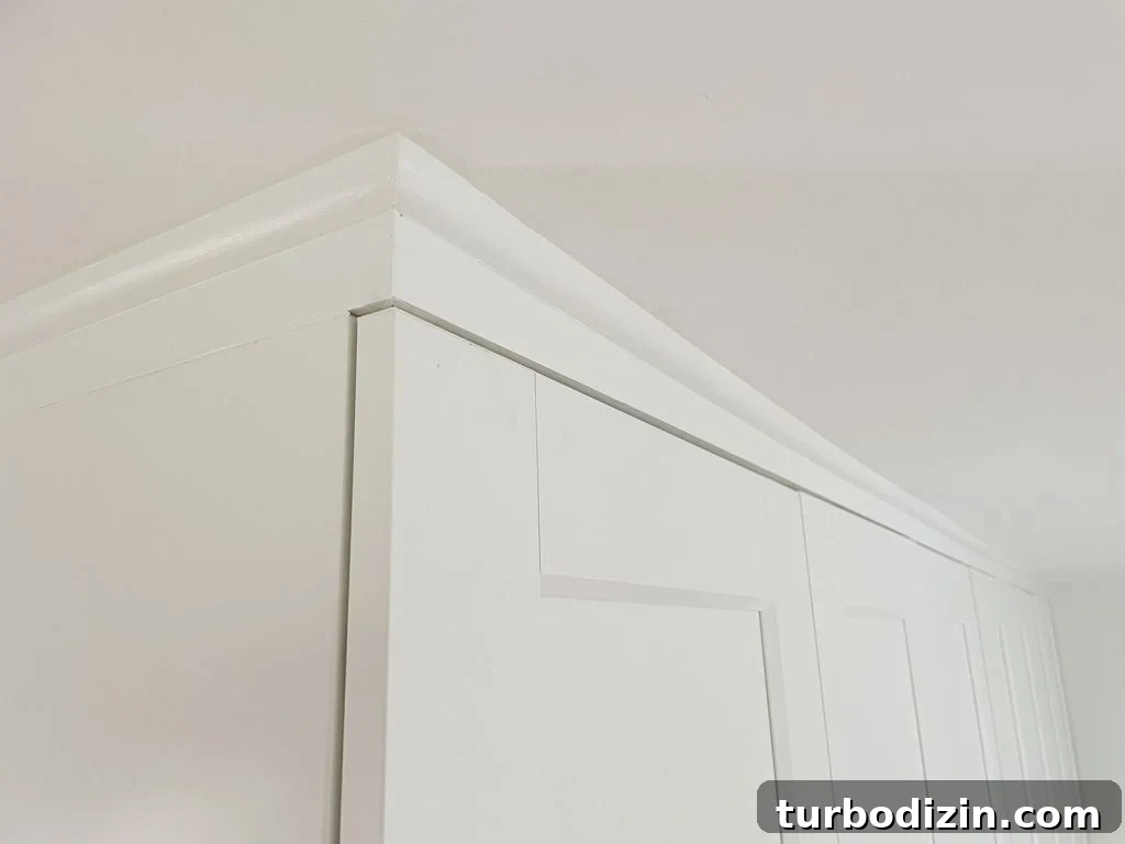 Make an Ikea PAX Wardrobe Look Like a Built-In Closet 12 Finished and painted quarter round molding that makes Ikea Pax Wardrobes look built in