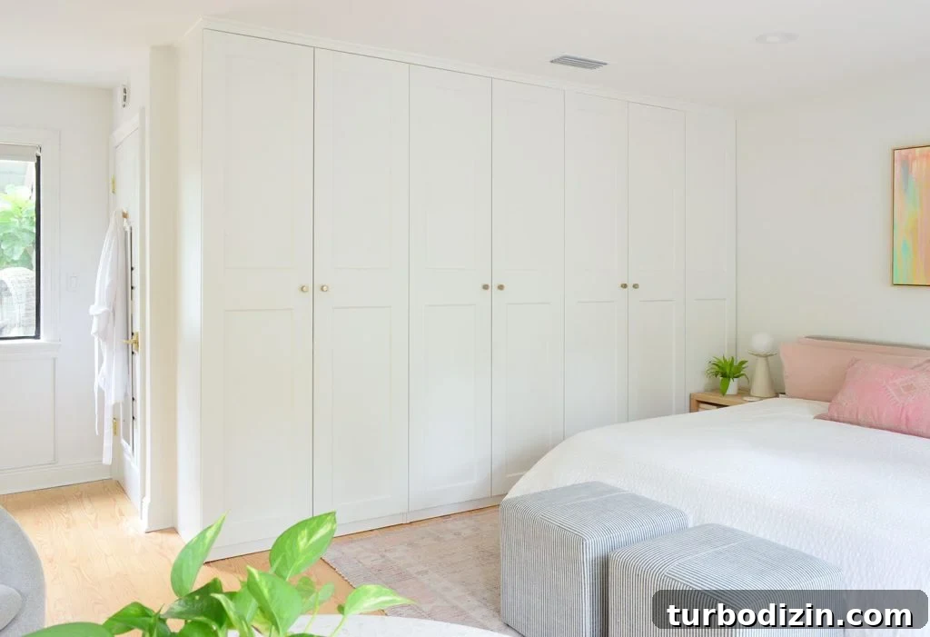 Make an Ikea PAX Wardrobe Look Like a Built-In Closet 7 Row of Ikea Pax Wardrobe Closets In Bedrom With Gold Knobs