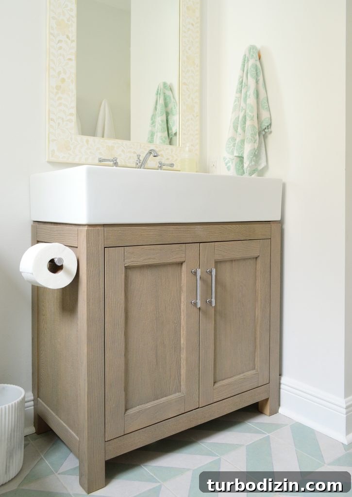 How Four People Share One Bathroom: Practical Tips That Work 8 Wood vanity in modern bathroom with mint chevron tile floor
