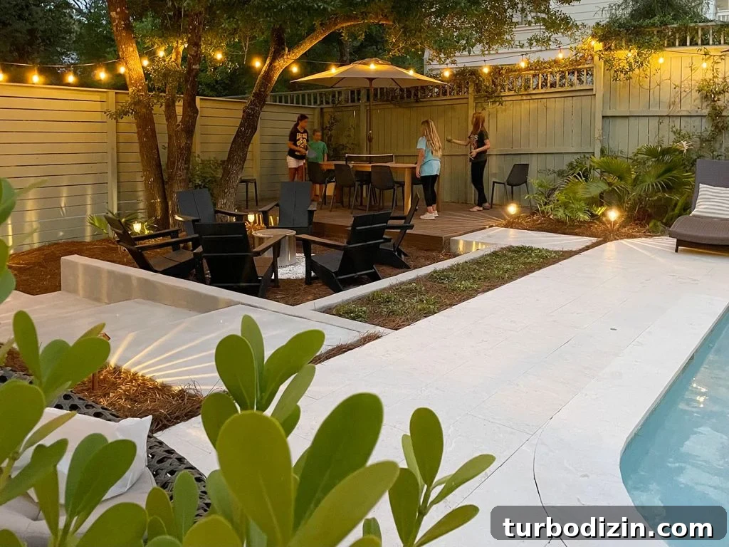 How We Transformed and Doubled Our Backyard Pool Area Space 9 Backyard Pool Area With Kids Playing Ping Pong On Dining Table