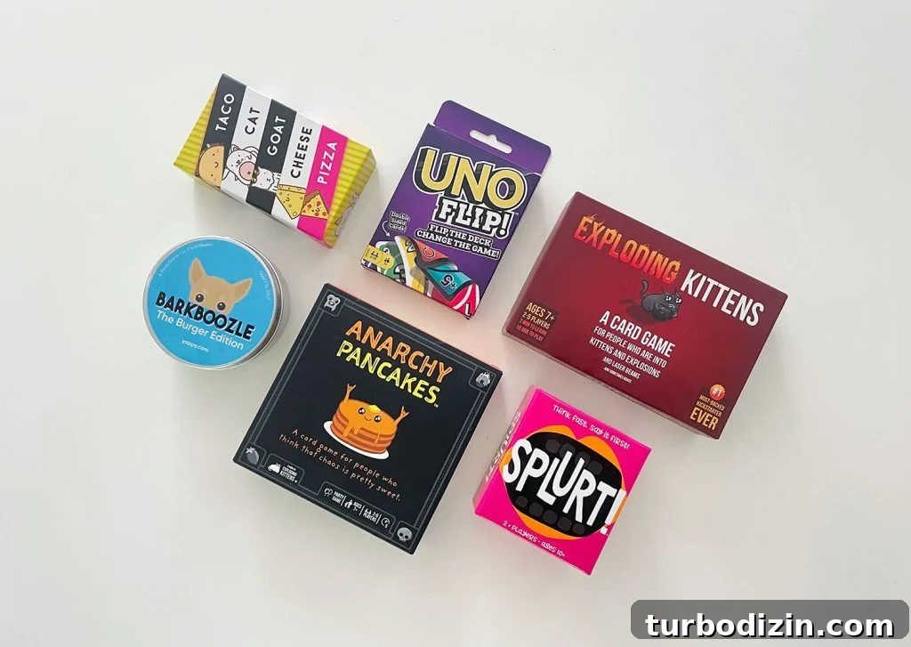 Top Family Board Games for Fun Nights With Kids 17 Best Travel Board Games Splurt Uno Flip Anarchy Pancakes Taco Cat Goat Cheese Pizza Barkboozled Exploding Kittens