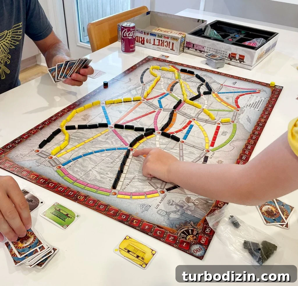 Top Family Board Games for Fun Nights With Kids 5 Family Playing Ticket To Ride Original Version