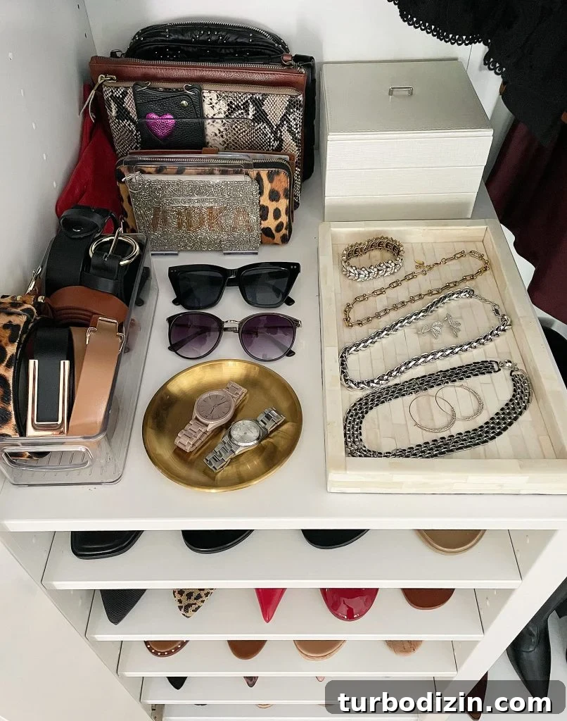 How We Optimized Our IKEA PAX Closet System for Storage 7 Ikea Pax Wardrobe Closet Overhead of Shelf With Jewelry And Clutches
