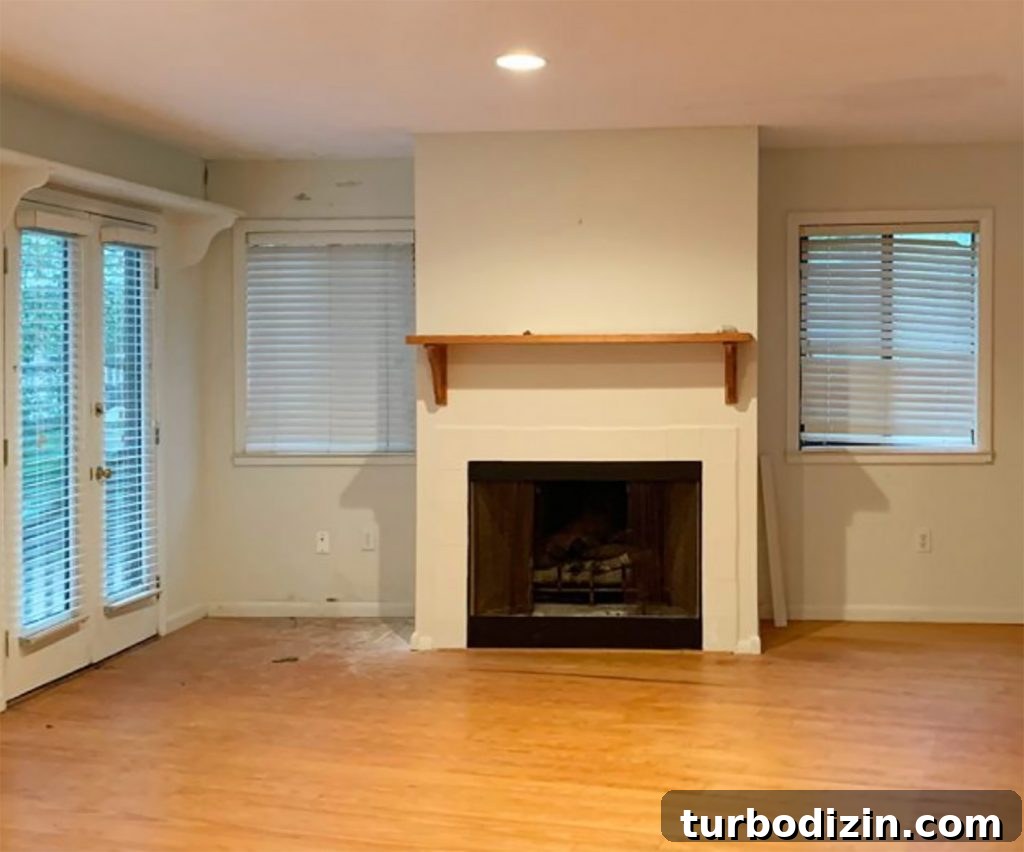 Before photo of fireplace in living room turned bedroom