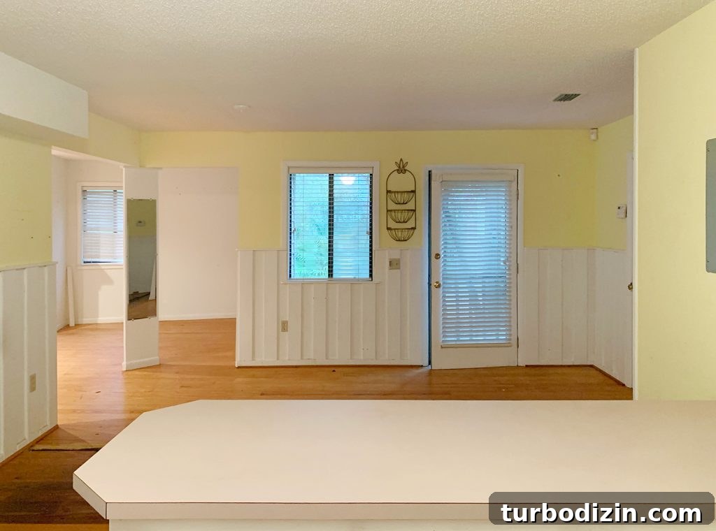 Before photo of kitchen with yellow walls into bedroom