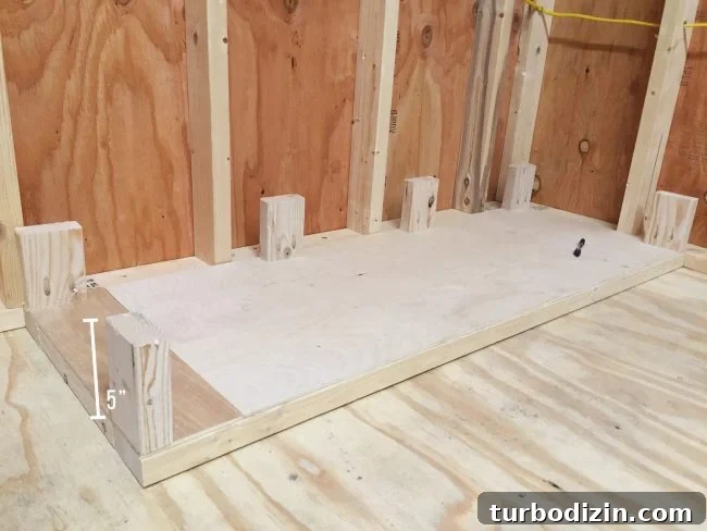 Adding small 5 inch posts to bottom of scrap wood storage organizer