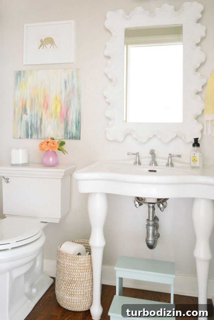 Benjamin Moore Edgecomb Gray: A Timeless Greige for Any Room 12 Half bathroom with console sink and Edgecomb Gray Walls