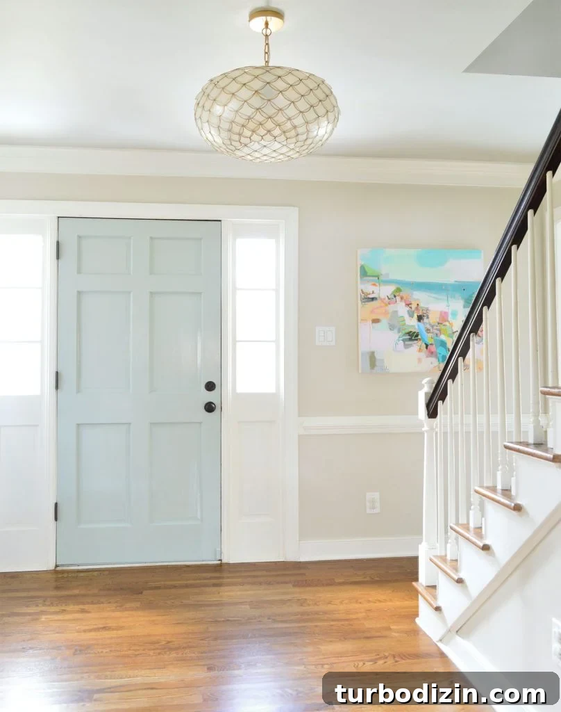 Benjamin Moore Edgecomb Gray: A Timeless Greige for Any Room 14 Entrway With Edgecomb Gray Paint And Soft Blue Door