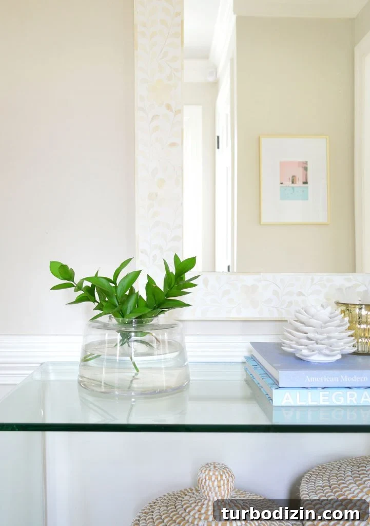Benjamin Moore Edgecomb Gray: A Timeless Greige for Any Room 8 Detail of Edgecomb Gray Entryway With Mirror And Plant