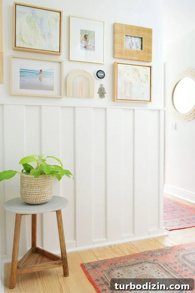 Sherwin-Williams Pure White SW 7005: Ideal Whole-House Paint Color 10 Wainscoting Molding In Hallway Painted SW Pure White