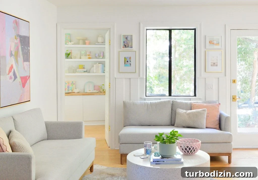 Sherwin-Williams Pure White SW 7005: Ideal Whole-House Paint Color 4 Close Up View Of Sitting Area With Gray Loveseats And Pure White Walls