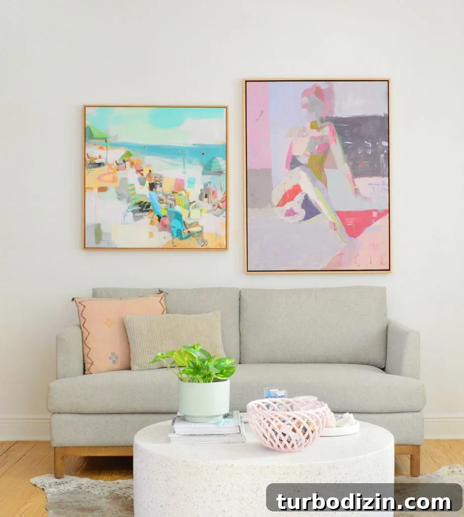 Sherwin-Williams Pure White SW 7005: Ideal Whole-House Paint Color 5 Loveseat With Colorful Paintings On SW Pure White Walls