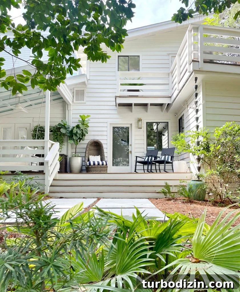 Sherwin-Williams Pure White SW 7005: Ideal Whole-House Paint Color 9 Exterior Of White Modern Home With Siding And Florida Landscaping