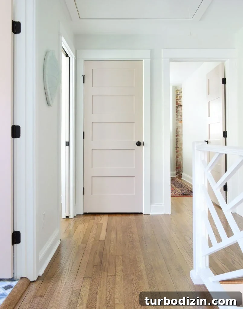 Hallway Upstairs Landing With Pink Doors And Extra White Trim