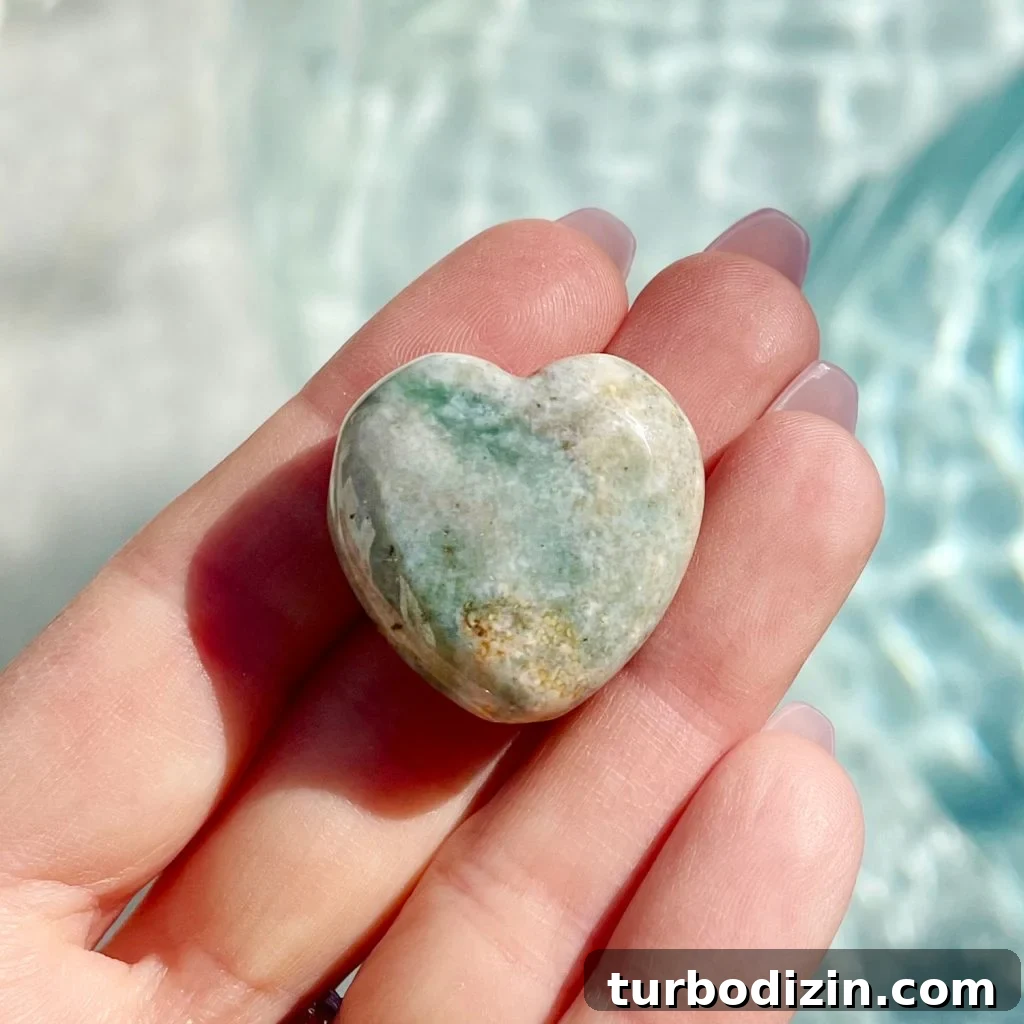 Ocean Jasper Meaning and Healing Properties: Uses & Benefits 2 Ocean Jasper Crystal Stone Heart In Hand