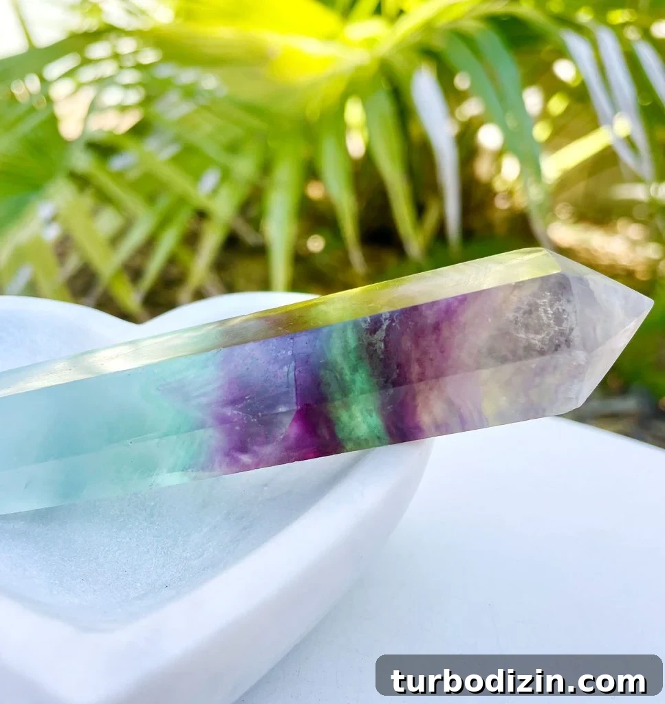 Rainbow Fluorite Meaning and Uses: Healing Properties & Care 5 Rainbow Fluorite Crystal In Stone Dish With Plan In Background