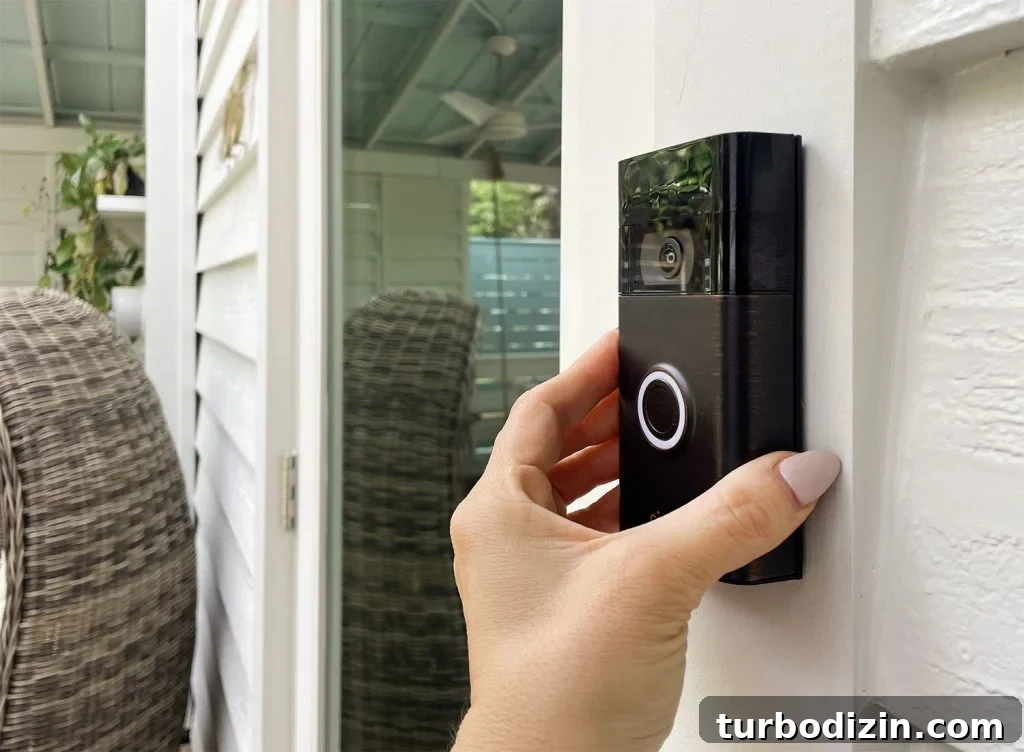 Install Your Ring Doorbell in 5 Simple Steps 11 Hand Placing Ring Video Doorbell Onto Mount