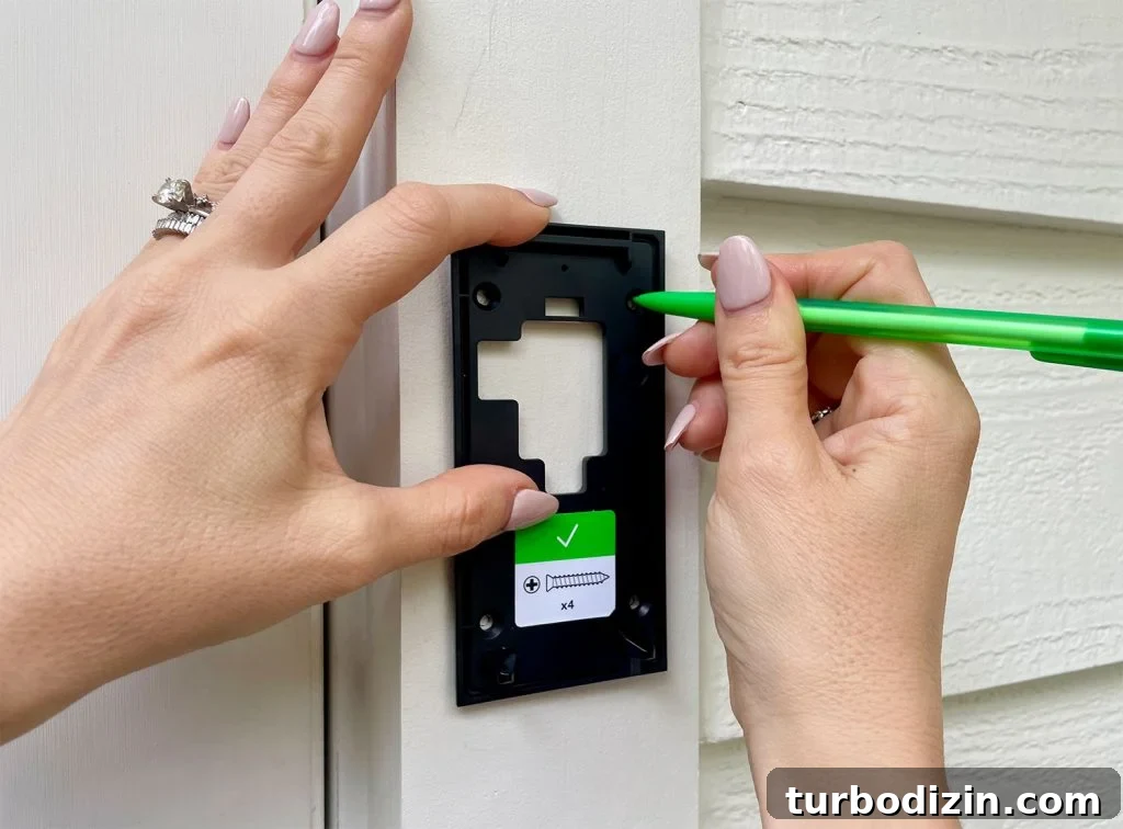 Install Your Ring Doorbell in 5 Simple Steps 8 Using Pencil to Mark Holes On Ring Doorbell Mounting Plate