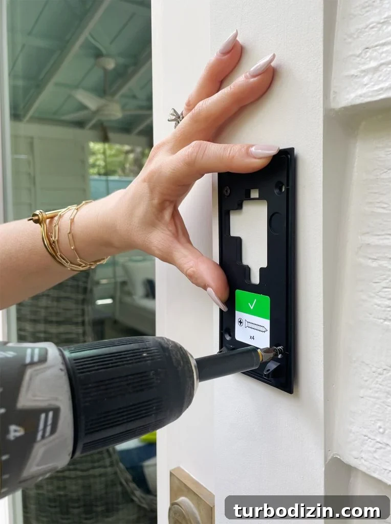 Install Your Ring Doorbell in 5 Simple Steps 10 Screwing Ring Doorbell Mounting Plate To Front Door Frame