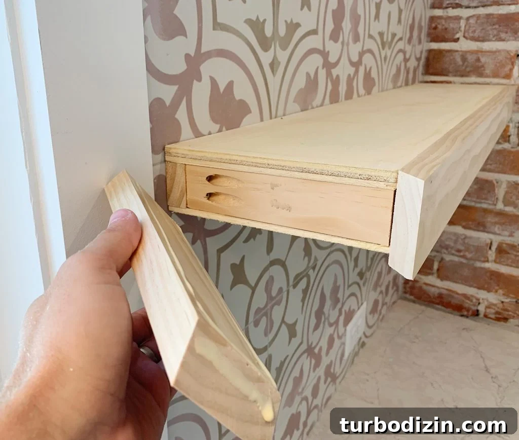 How to Install Floating Kitchen Shelves: Step-by-Step Guide 11 Hand Adding Side Trim Piece To DIY Floating Kitchen Shelves