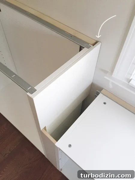 Built-In Cabinet Guide: Design, Installation, and Tips 8 white cabinet filler pieces used to cover exposed side of Ikea cabinet installation