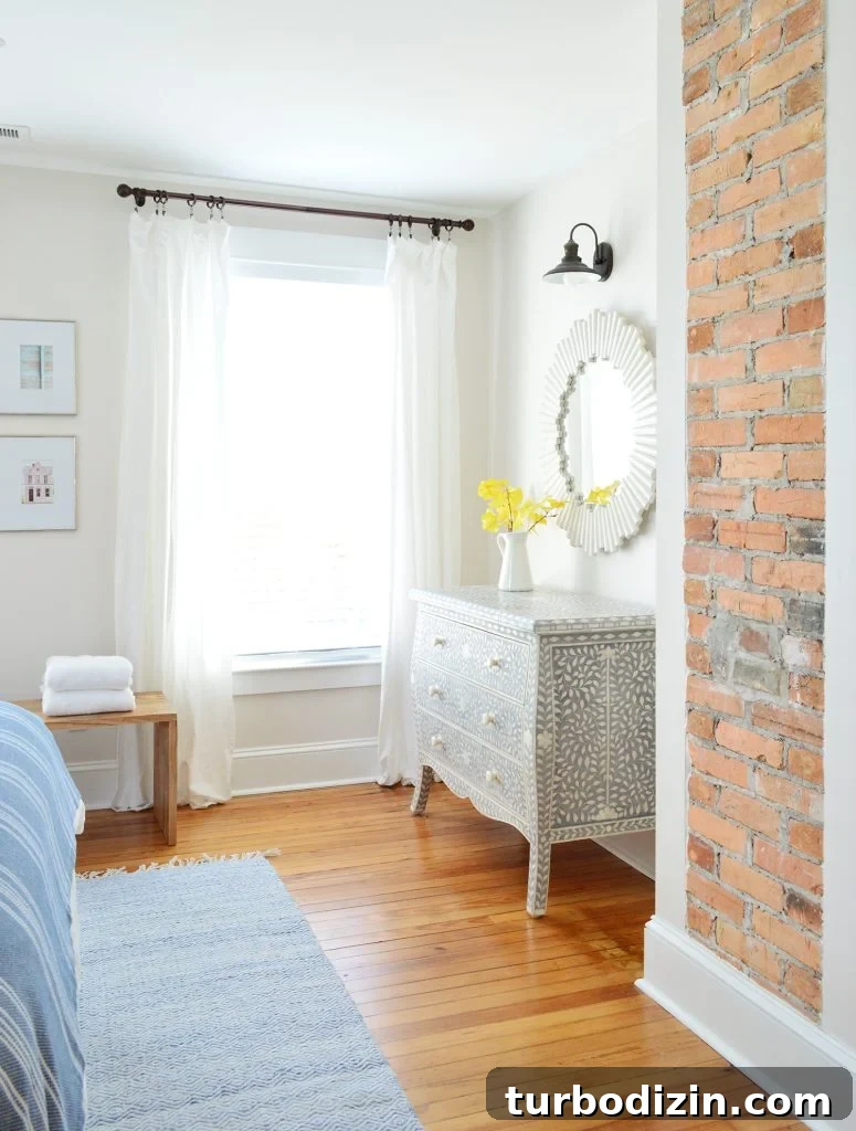 9 Expert-Recommended Greige Paint Colors You’ll Love 21 Exposed Brick Fireplace In Beach House Front Bedroom And Inlay Dresser