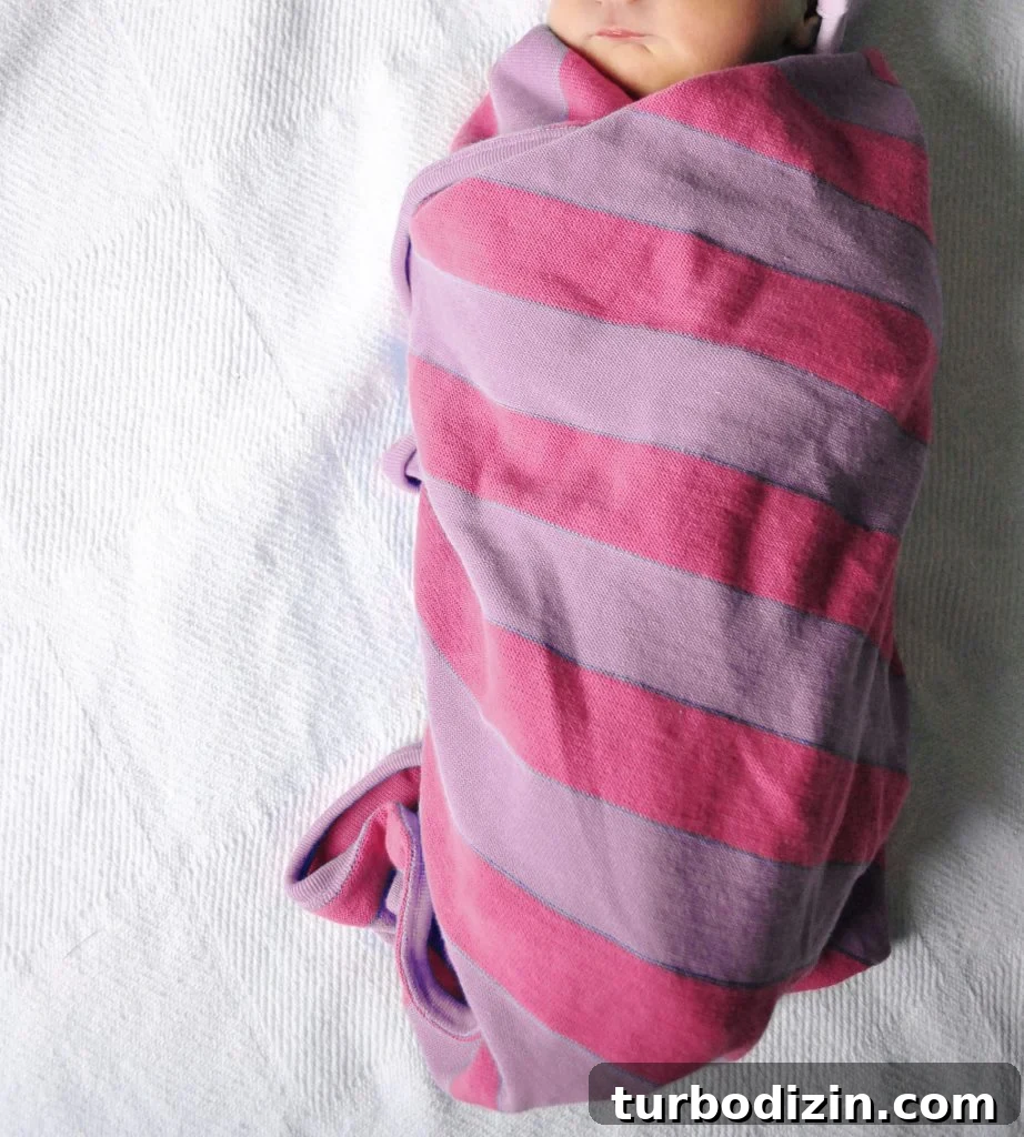 100 Classic Girls' Names That Stand the Test of Time 4 Newborn Baby Girl Swaddled In Pink Purple Striped Blanket