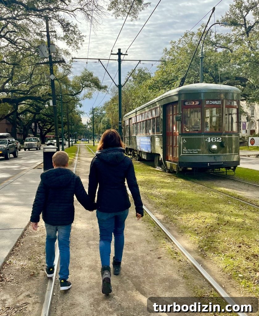 48 Hours in New Orleans with Kids: Family Weekend Guide 13 Mom And Child Walking Near New Orleans Street Car