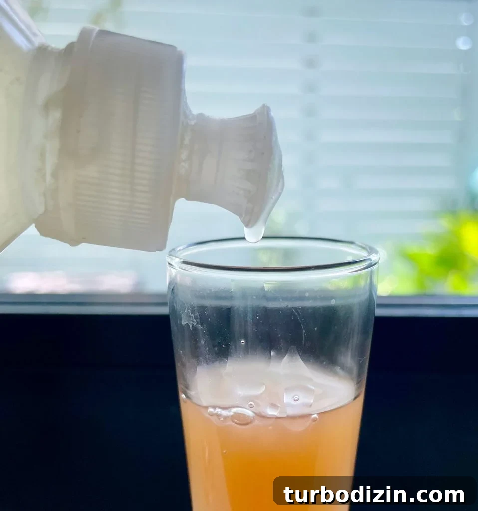Get Rid of Fruit Flies Fast Using Items You Already Have at Home 9 Dripping Dish Soap Into Apple Cider Vinegar For DIY Fruit Fly Trap
