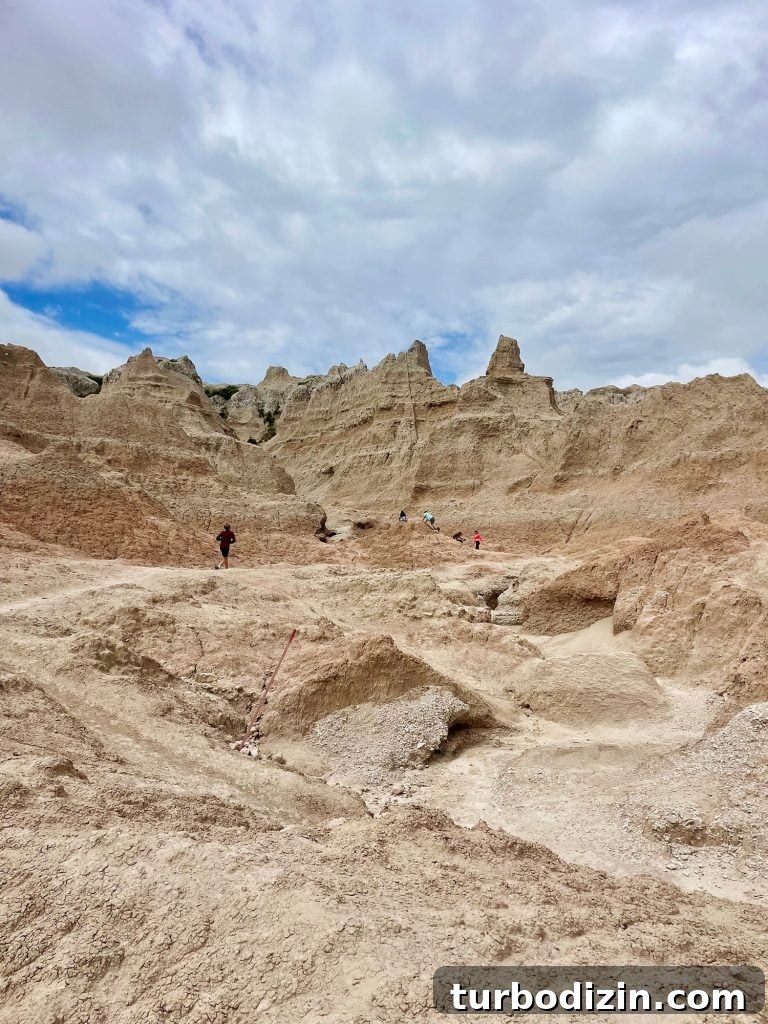 South Dakota Summer Road Trip: Top Sights & Itinerary Ideas 15 Kids Playing On Rock Formations in Badlands National Park South Dakota