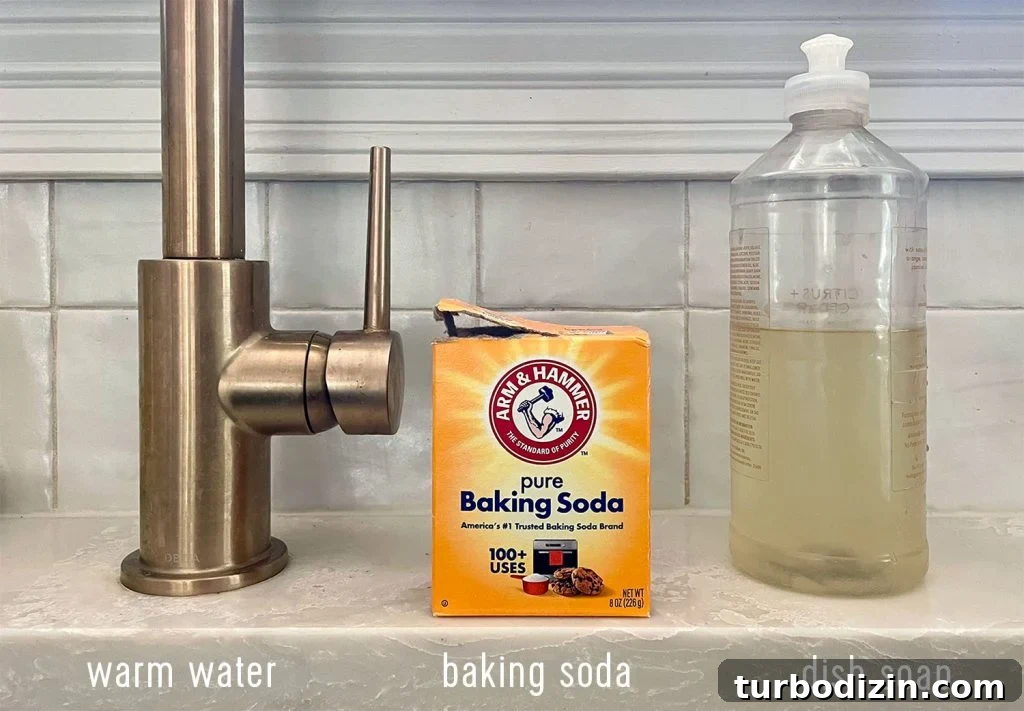 3 Supplies for cleaning a stainless steel sink warm water baking soda dish soap